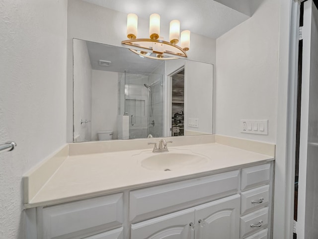 744 Greenhaven Dr, Richardson, TX 75080 - bathroom featuring a stall shower, a chandelier, vanity, and toilet