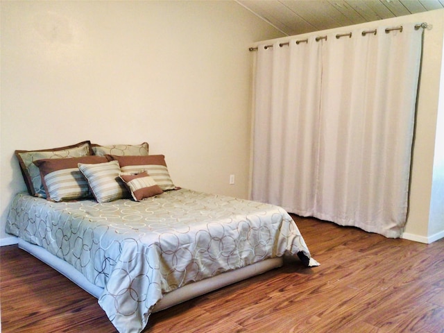 744 Greenhaven Dr, Richardson, TX 75080 - bedroom with lofted ceiling, wood finished floors, and baseboards
