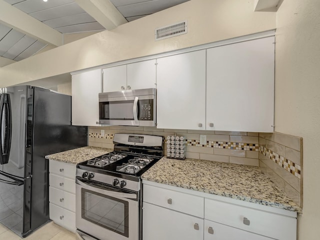 744 Greenhaven Dr, Richardson, TX 75080 - kitchen with stainless steel appliances, decorative backsplash, white cabinets, and light stone countertops