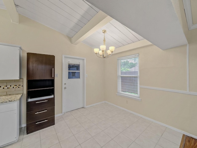 744 Greenhaven Dr, Richardson, TX 75080 - unfurnished dining area featuring a chandelier and baseboards