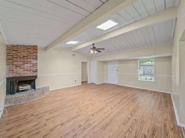 744 Greenhaven Dr, Richardson, TX 75080 - unfurnished living room with wood finished floors, ceiling fan, a brick fireplace, and baseboards