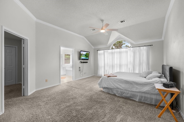 carpeted bedroom with crown molding, a textured ceiling, vaulted ceiling, ensuite bath, and baseboards
