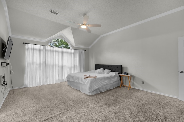 bedroom featuring crown molding, carpet, vaulted ceiling, ceiling fan, and a textured ceiling