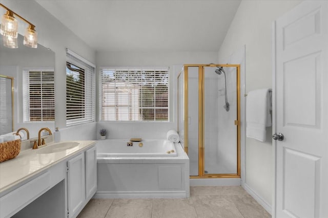 full bath with vanity, a stall shower, a bath, and tile patterned floors