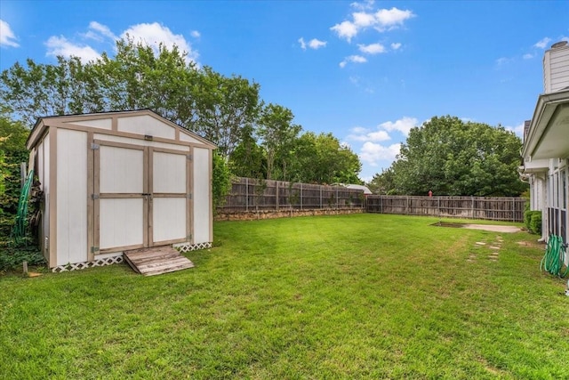 view of yard featuring a storage shed and an outdoor structure