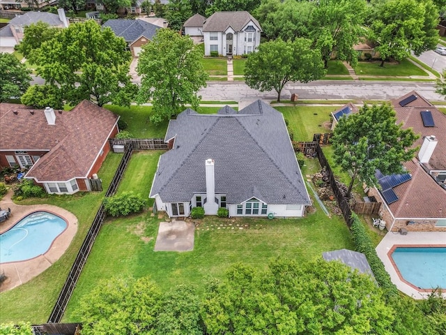 aerial perspective of suburban area featuring a pool area