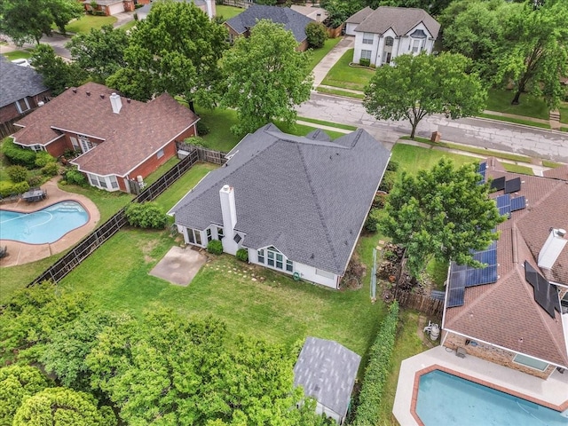 aerial perspective of suburban area with a pool area