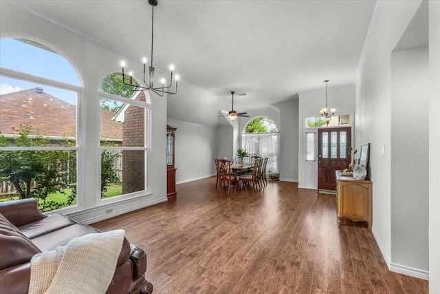 living area featuring a chandelier, baseboards, dark wood-type flooring, a ceiling fan, and ornamental molding