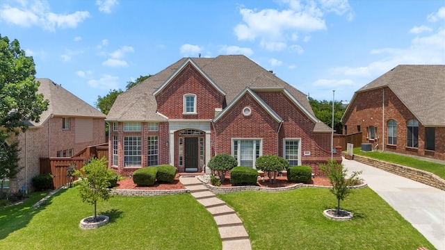 2609 Green Oak Dr, Carrollton, TX 75010 - georgian-style home with brick siding and driveway