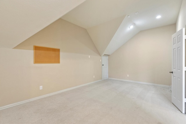 2609 Green Oak Dr, Carrollton, TX 75010 - additional living space with vaulted ceiling, light carpet, baseboards, and recessed lighting