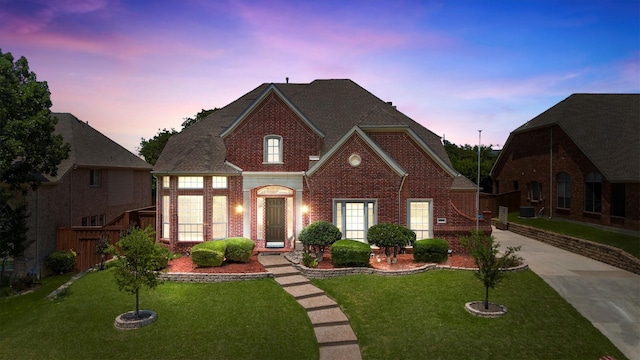 2609 Green Oak Dr, Carrollton, TX 75010 - georgian-style home with brick siding and concrete driveway