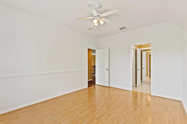 2609 Green Oak Dr, Carrollton, TX 75010 - unfurnished bedroom with light wood-type flooring, baseboards, and ceiling fan