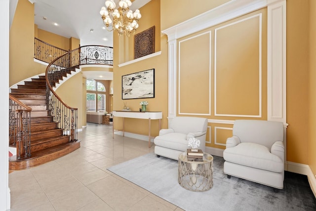 2609 Green Oak Dr, Carrollton, TX 75010 - sitting room featuring baseboards, a towering ceiling, stairway, a chandelier, and tile patterned flooring
