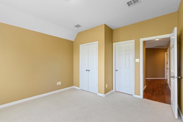 2609 Green Oak Dr, Carrollton, TX 75010 - unfurnished bedroom featuring attic access, light colored carpet, baseboards, a closet, and lofted ceiling