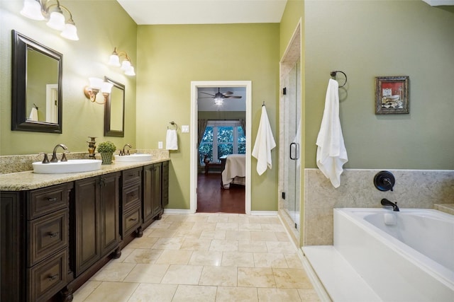 7300 Bishop Ct, Fort Worth, TX 76179 - ensuite bathroom with a ceiling fan, a bath, double vanity, and a stall shower