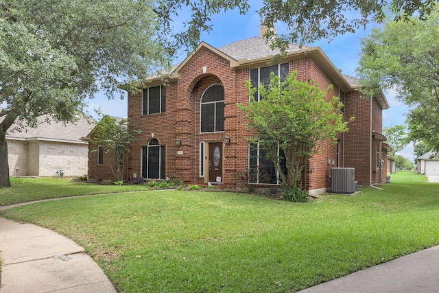 533 Cameron Ln, Allen, TX 75002 - traditional-style house featuring cooling unit, a front lawn, brick siding, and a chimney