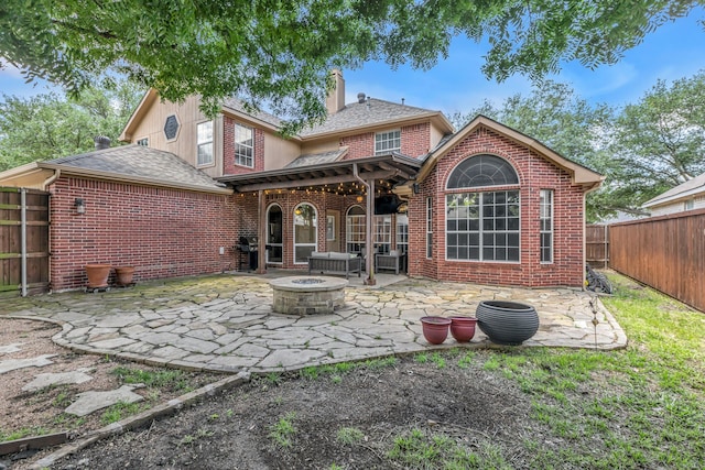 533 Cameron Ln, Allen, TX 75002 - rear view of house with brick siding, a patio area, a fire pit, and a chimney