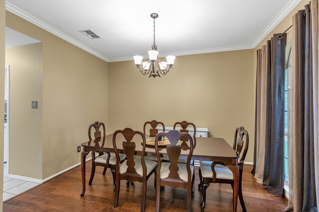 533 Cameron Ln, Allen, TX 75002 - dining area with crown molding, a chandelier, wood finished floors, and baseboards