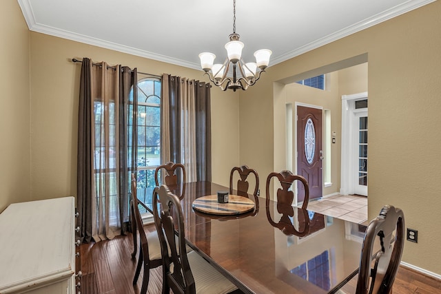533 Cameron Ln, Allen, TX 75002 - dining area featuring a chandelier, wood finished floors, ornamental molding, and baseboards