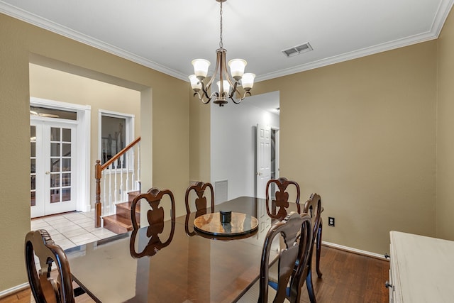 533 Cameron Ln, Allen, TX 75002 - dining room featuring crown molding, wood finished floors, a chandelier, french doors, and baseboards