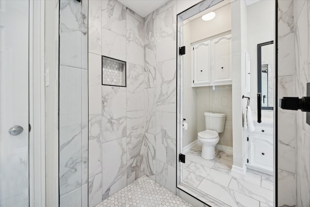 full bath featuring marble look tile flooring, toilet, and a stall shower