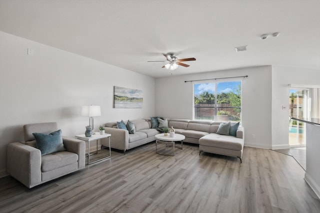 4800 Blue Top Dr, Fort Worth, TX 76179 - living room featuring light wood-style flooring, ceiling fan, and baseboards