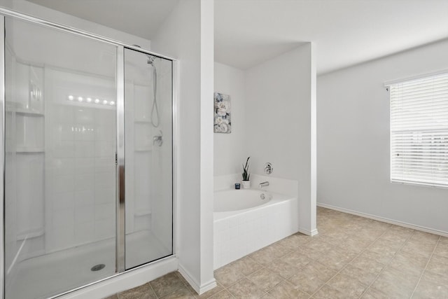 4800 Blue Top Dr, Fort Worth, TX 76179 - bathroom featuring a shower stall, a bath, and baseboards