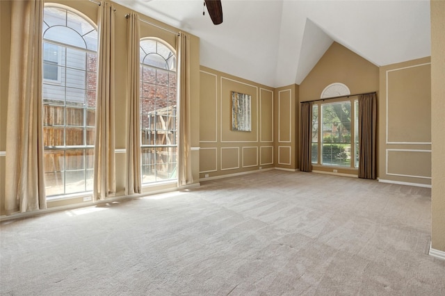 6748 Bastille Dr, Plano, TX 75024 - carpeted empty room featuring a decorative wall, a ceiling fan, and high vaulted ceiling
