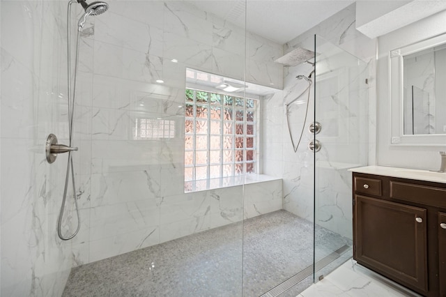 6748 Bastille Dr, Plano, TX 75024 - full bath featuring a marble finish shower, vanity, and marble finish flooring