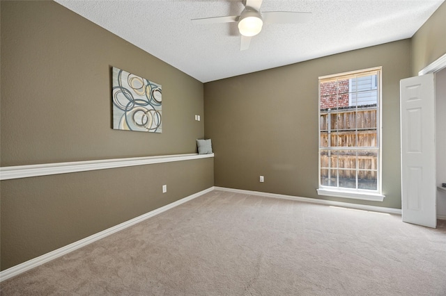 6748 Bastille Dr, Plano, TX 75024 - empty room featuring ceiling fan, carpet, a textured ceiling, and baseboards