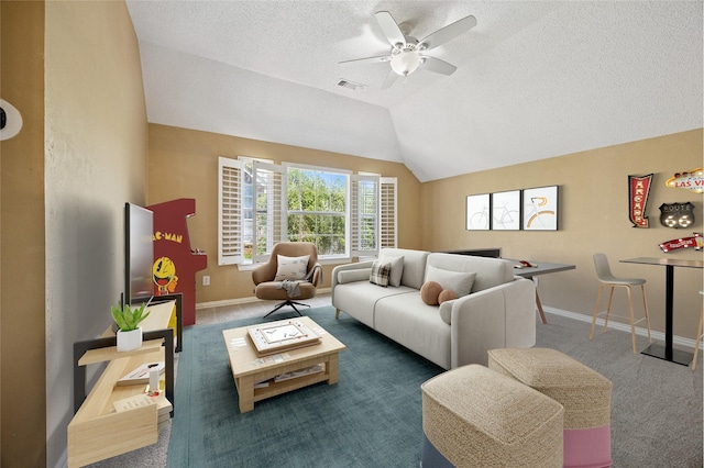 6748 Bastille Dr, Plano, TX 75024 - carpeted living area with a ceiling fan, a textured ceiling, baseboards, and vaulted ceiling