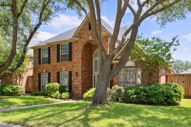 6748 Bastille Dr, Plano, TX 75024 - traditional-style house featuring brick siding and a shingled roof