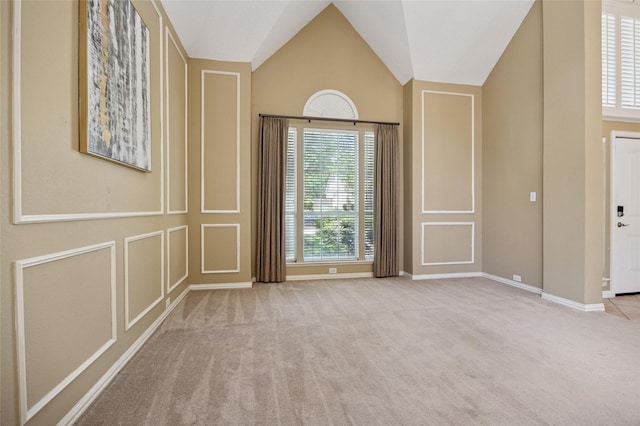 6748 Bastille Dr, Plano, TX 75024 - spare room with carpet, lofted ceiling, baseboards, and a decorative wall