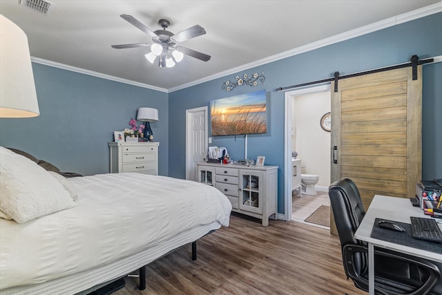 503 Sundrop Dr, Fate, TX 75132 - bedroom featuring a barn door, ornamental molding, wood finished floors, ensuite bathroom, and a ceiling fan
