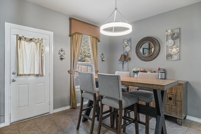503 Sundrop Dr, Fate, TX 75132 - dining space with tile patterned floors and baseboards