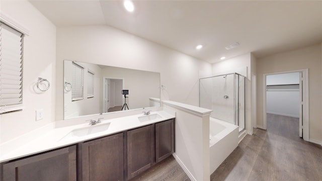 2045 Juniper Pass Way, Mesquite, TX 75149 - full bathroom featuring a shower with door, wood finished floors, a tub, double vanity, and lofted ceiling