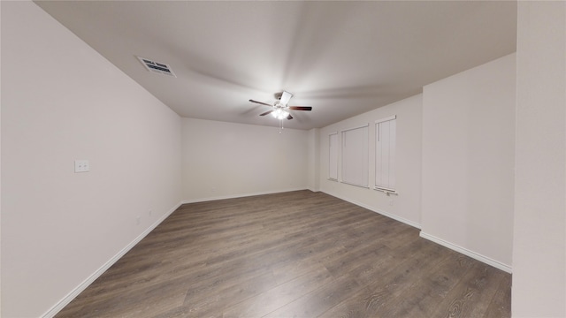 2045 Juniper Pass Way, Mesquite, TX 75149 - empty room featuring a ceiling fan, dark wood-style flooring, and baseboards
