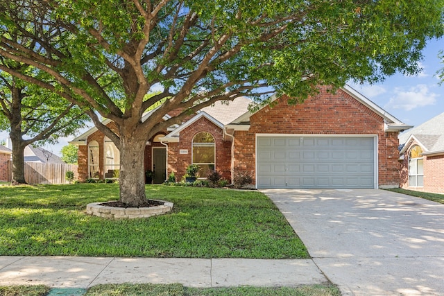 12306 Ark Rd, Frisco, TX 75035 - view of front of house with concrete driveway, a garage, and brick siding
