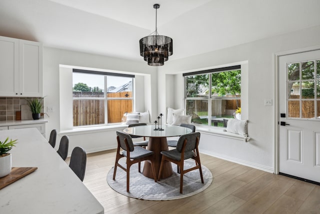 12306 Ark Rd, Frisco, TX 75035 - dining area featuring plenty of natural light, a chandelier, baseboards, and light wood finished floors