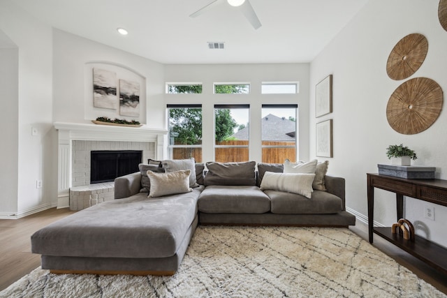 12306 Ark Rd, Frisco, TX 75035 - living room featuring a ceiling fan, wood finished floors, a fireplace, baseboards, and recessed lighting