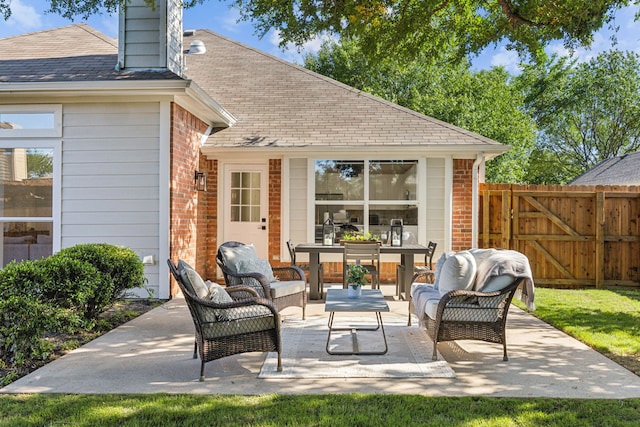 12306 Ark Rd, Frisco, TX 75035 - view of patio / terrace featuring fence, outdoor lounge area, a gate, and outdoor dining space