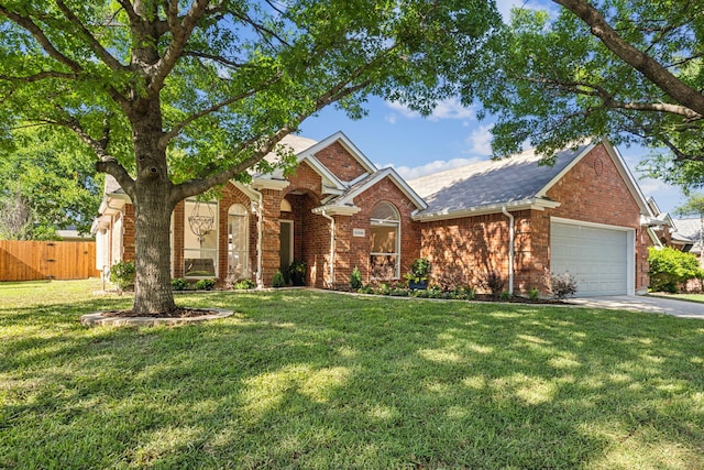 12306 Ark Rd, Frisco, TX 75035 - traditional-style home with brick siding, a garage, driveway, and roof with shingles