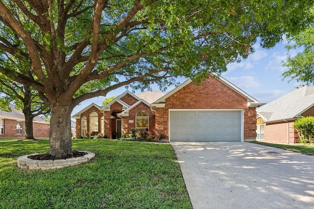 12306 Ark Rd, Frisco, TX 75035 - view of front of home featuring an attached garage, driveway, brick siding, and a front yard