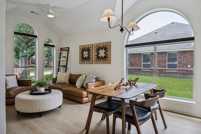 12306 Ark Rd, Frisco, TX 75035 - dining space with healthy amount of natural light, vaulted ceiling, ceiling fan, and light wood-style flooring