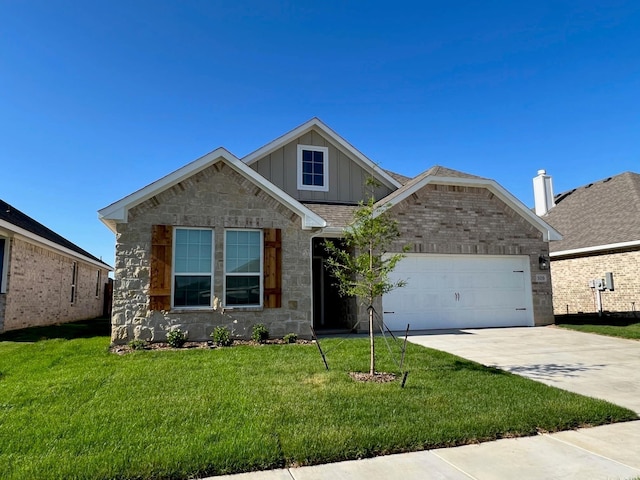 view of front of property with board and batten siding, a garage, driveway, and a front lawn