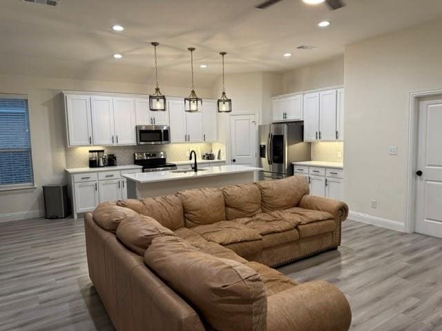 520 Mustang Ln, Pilot Point, TX 76258 - living room with light wood finished floors, recessed lighting, and ceiling fan