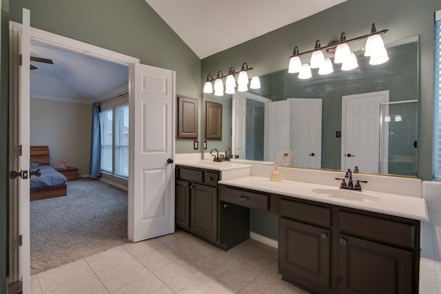 full bath featuring lofted ceiling, tile patterned floors, a stall shower, double vanity, and ensuite bathroom