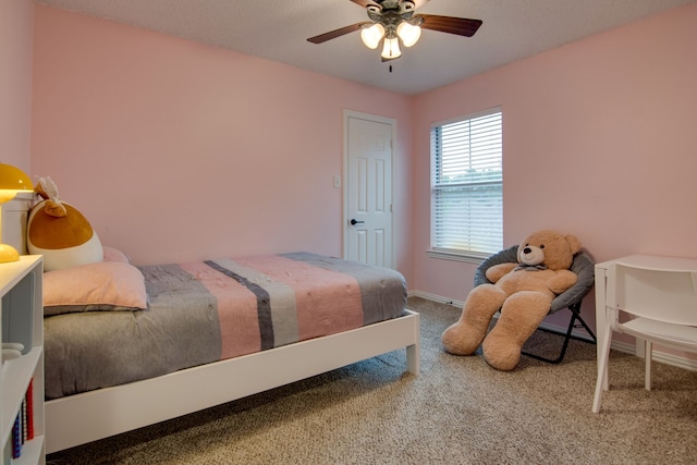 bedroom with carpet floors, ceiling fan, and baseboards