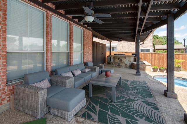 view of patio featuring fence, ceiling fan, and outdoor lounge area