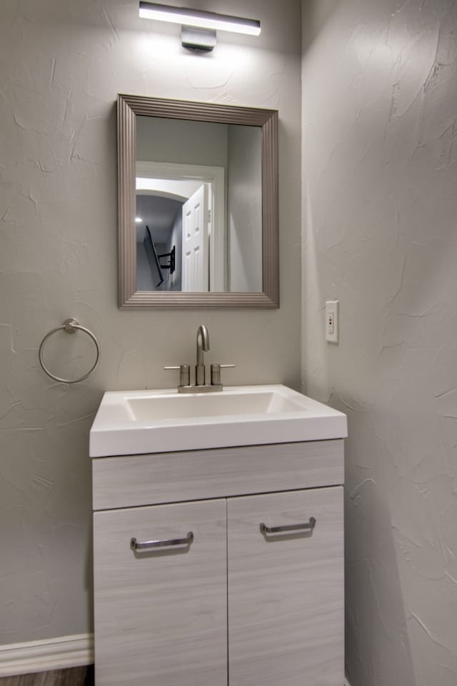 bathroom featuring vanity and baseboards